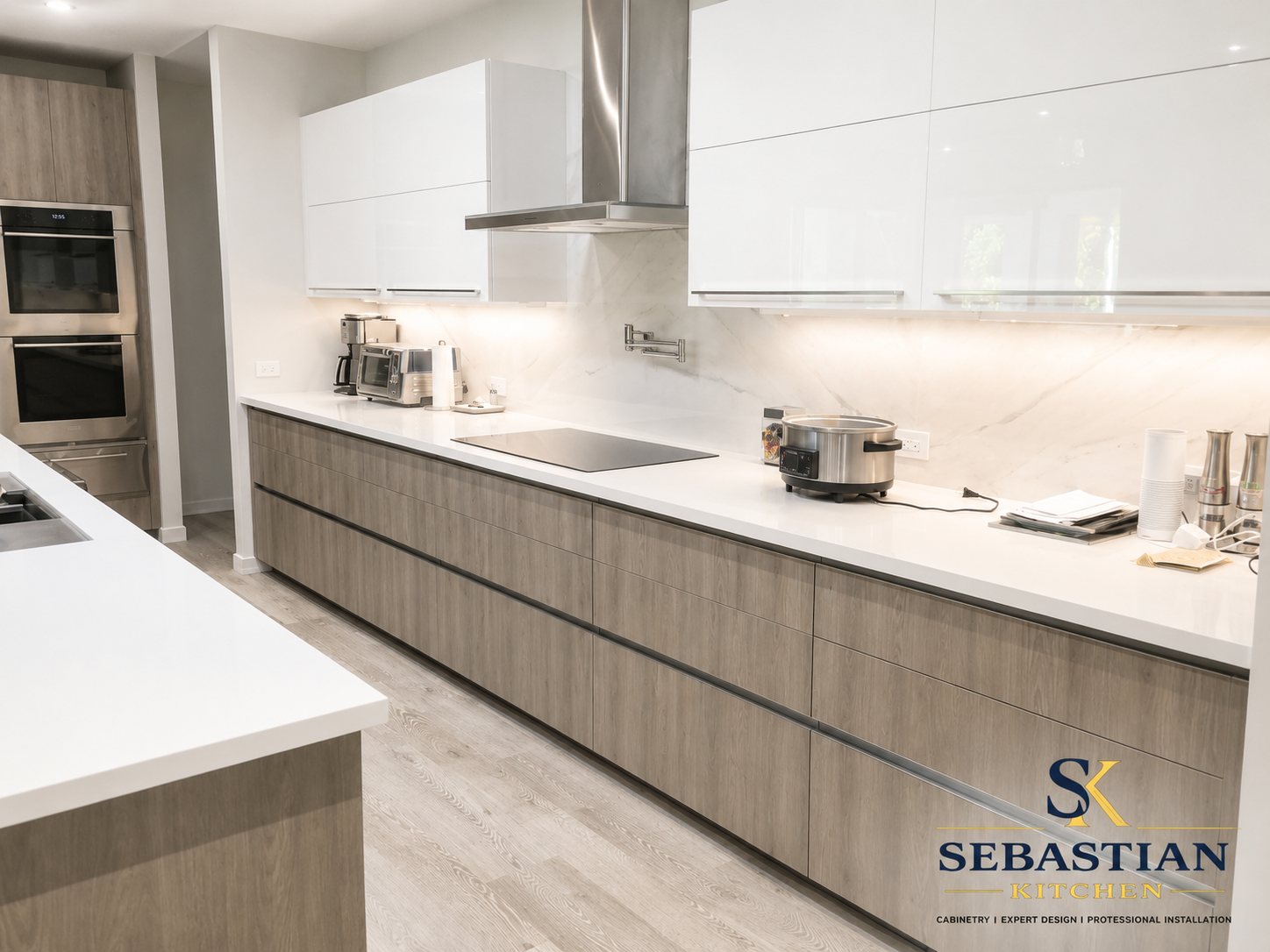 Two-tone modern kitchen with white uppers and wood-grain cabinets