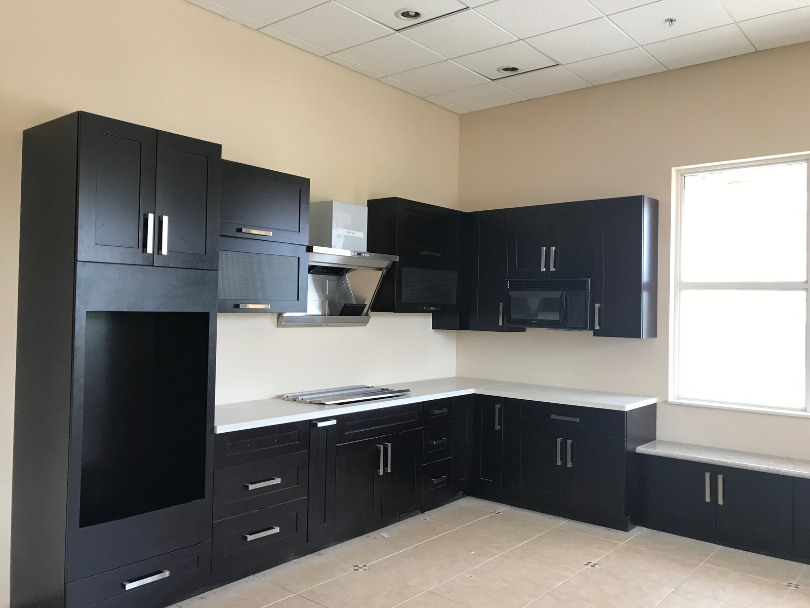 Espresso shaker kitchen with quartz countertops